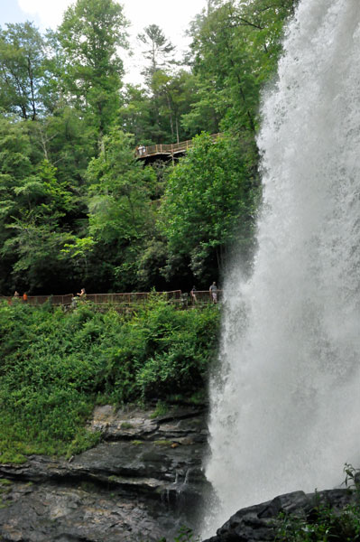 people on the two tiers of path and stairs leading to the falls.